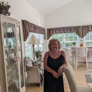 a woman standing in a living room