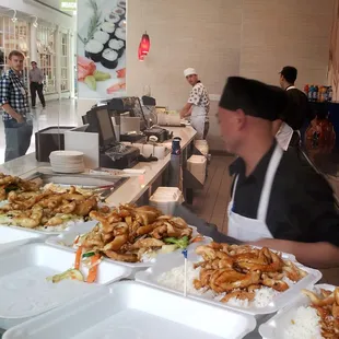Pick your veggies and white vs fried rice, then watch the cook prepare.  Many opt for the chicken teriyaki - shown.