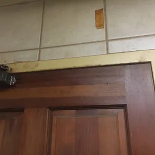 Interior door frame of men&apos;s room. Just about the worst I&apos;ve ever seen. Gateway tire is nicer than this place.