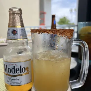 a bottle of modelo and a glass of beer