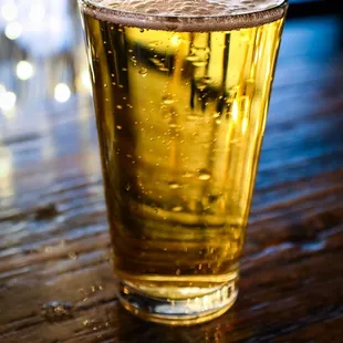 a glass of beer on a table