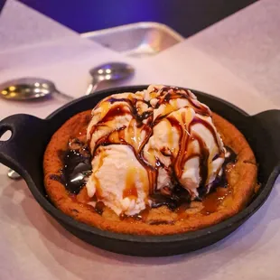a skillet with ice cream and caramel