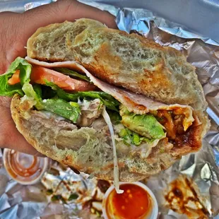 Carnitas Torta Cubana is a Must try.   SUPER FILLING!!!