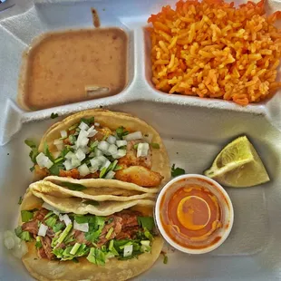 Carnitas &amp; chicken tacos Nice that it comes with Rice &amp; beans!!!   Really hit the spot