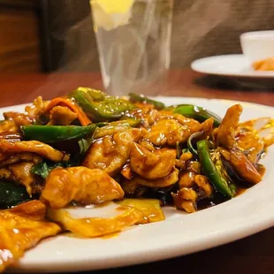 a plate of chicken and vegetables