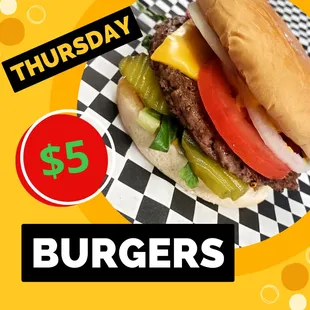 a hamburger with cheese and tomatoes