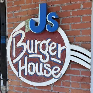 a sign on a brick building