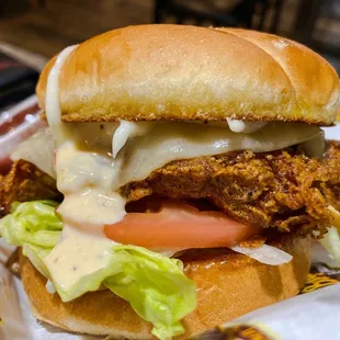 a chicken sandwich with lettuce and tomato
