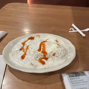 One biscuit and gravy with one over easy egg topped with chololula sauce...YUMMY!!