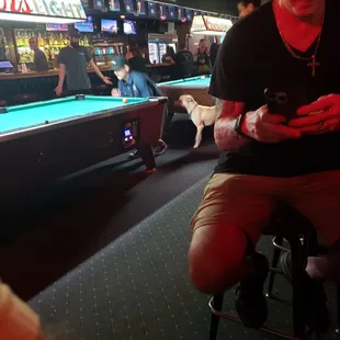 View of the bar and pool tables