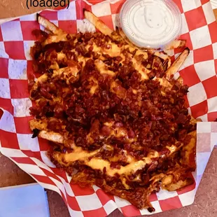 A mom and her son licked this clean at the table behind us. LOADED FRIES!