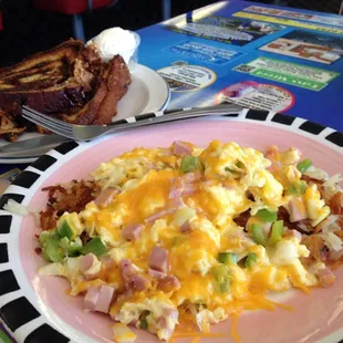 Denver scramble over hashbrowns and from scratch homemade cinnamon raisin bread