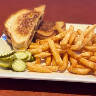 a grilled cheese sandwich and french fries