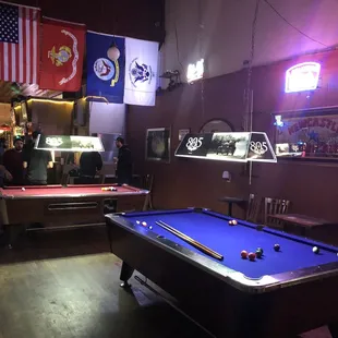 a pool table in the foreground