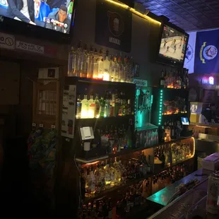 a bar with a variety of liquors