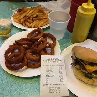 My overcooked onion rings and my receipt that proves my cheeseburgers were $1 each more than the stated menu price of $4.19.