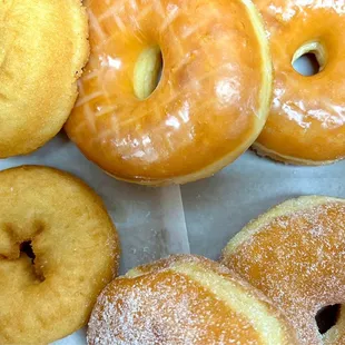 Various donuts (plain, glazed, sugar).