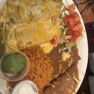Cheese enchiladas. One with green one with queso. Beans and rice were really good too!