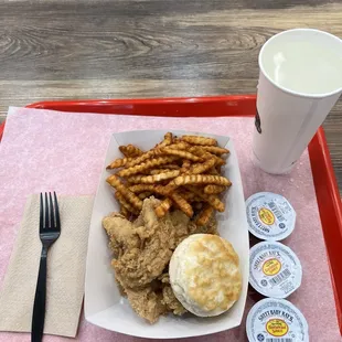 Three piece chicken tender combo with fries, biscuit and drink. Also purchased three bbq sauces