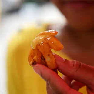 a person holding a piece of food