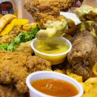 a plate of fried chicken and french fries