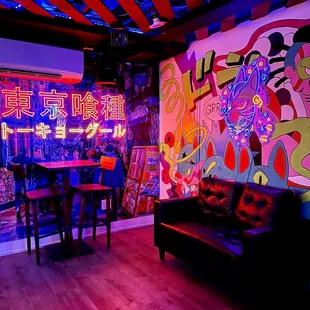 a brightly lit bar with neon lights
