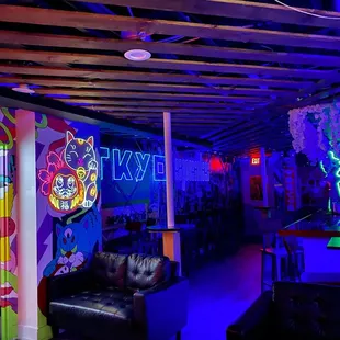 a neon sign in a bar