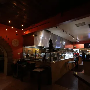 First sight as you walk in. Open kitchen to the center &amp; right. Go left, straight, then right for seating.