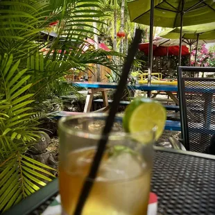 a glass of lemonade on a table