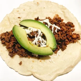 A Chorizo Taco w Avocado, delicious and complimentary w Yelp sign in!