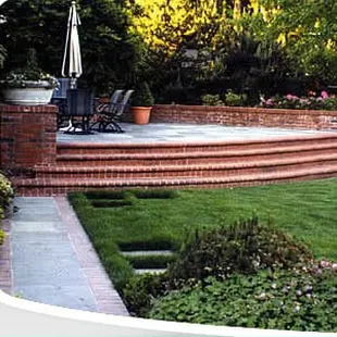 a brick patio and lawn