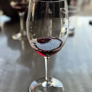 a glass of wine on a table