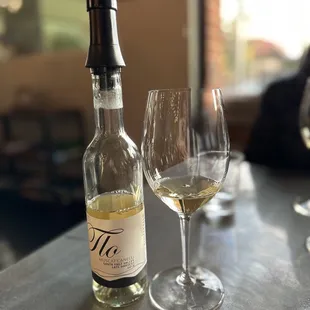 a bottle of wine and a glass of wine