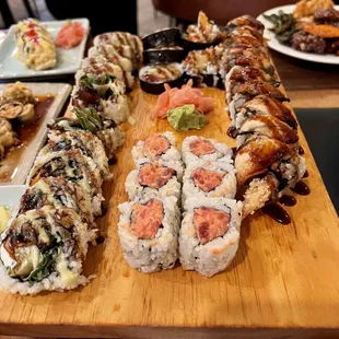 Left: Godzilla Roll; Right: Dragon Roll; Front: Spicy Salmon Roll; Back: Tempura roll