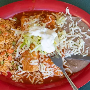Dinner Enchilada with beans and rice.