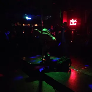 a man on a skateboard in the dark