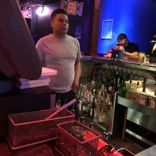 a man standing at a bar