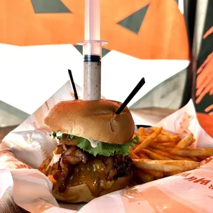 a fork sticking out of the top of the burger