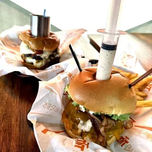two burgers and french fries