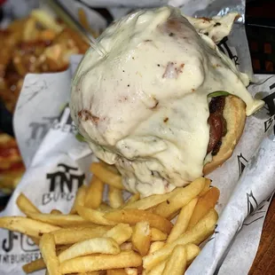 Cheesy Beast- topped with smoked beef sausages, lettuce, tomato. Smothered and drenched in mozzarella cheese