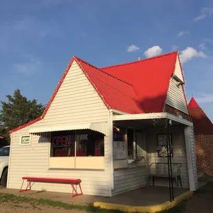 a white building with a red roof