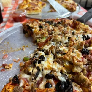 a half eaten pizza on a table