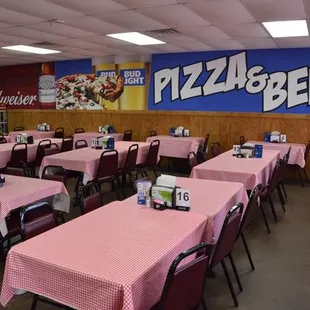 tables and chairs with pink tablecloths