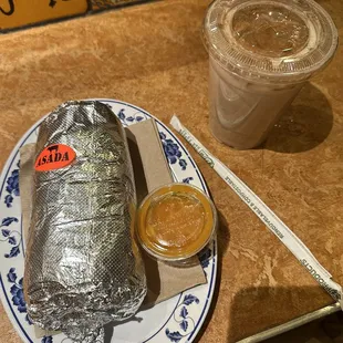 Carne asada burrito with roasted jalapeño hot sauce and horchata.