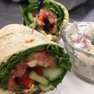 a wrap and a bowl of salad