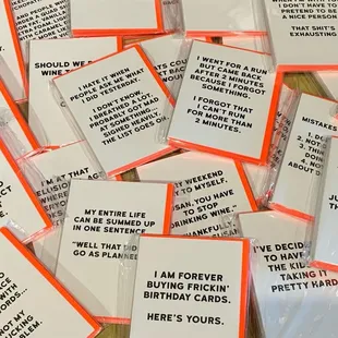 a pile of orange and white cards