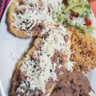 Huarraches are so good. Its like deep fried bread topped with beef.