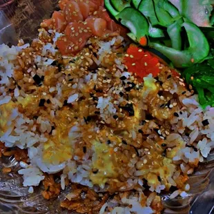 Build your own bowl: salmon  in sesame seed oil, seaweed salad, green onions, fish eggs, cucumbers, and tofu topped with sesame seeds