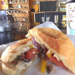 Delicious Grilled Chicken Melt Panini with onion and colorful bell peppers.
