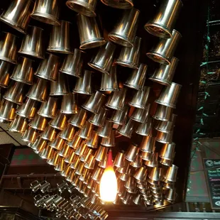 Mugs hanging above the bar - very cute